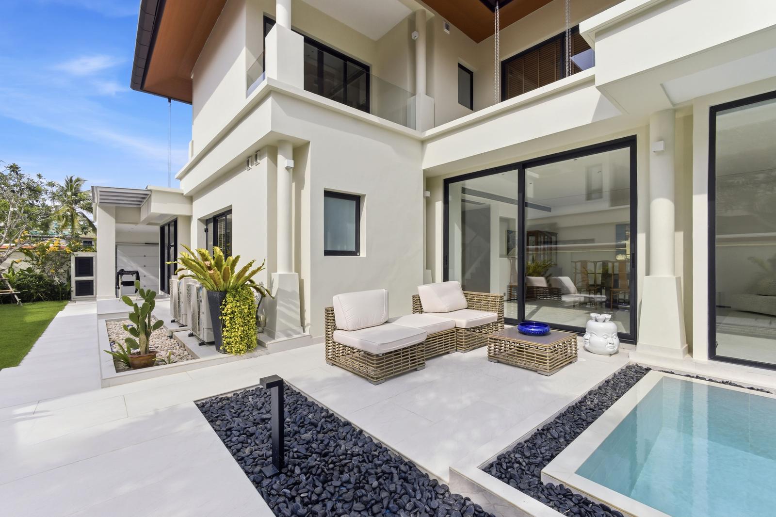 Villa facade with private pool and lounge terrace